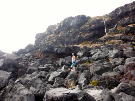 Then we turned around and began to climb to the top. (See Pappa Joe up there? Esther climbed straight up that rock face fearlessly.) All of this black rock is lava rock~ but once you get around the corner, the color changes drastically.